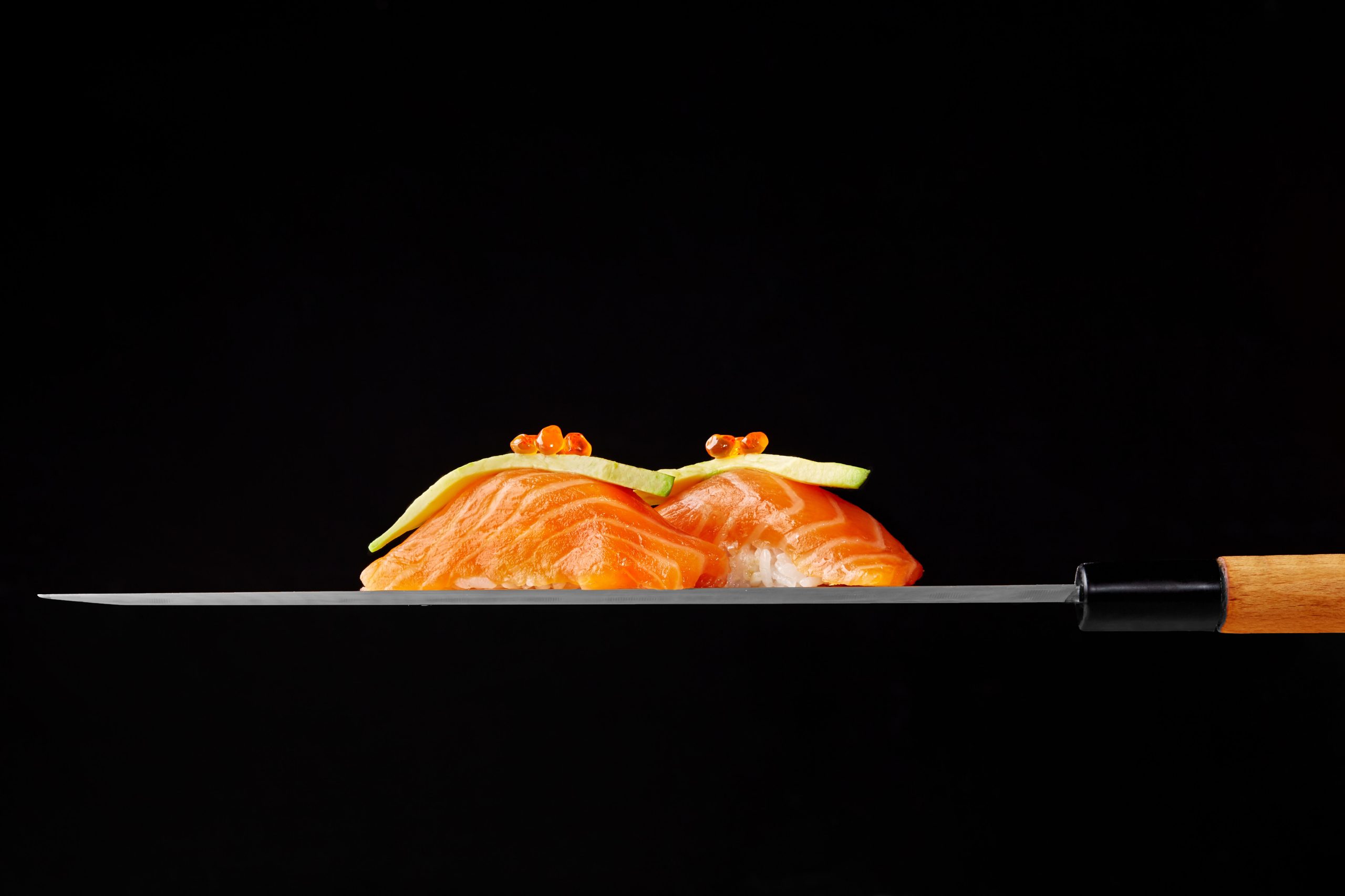 nigiri-sushi-with-raw-salmon-avocado-red-caviar-blade-japanese-knife (1)