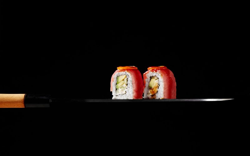 uramaki-rolls-with-tuna-cream-cheese-avocado-kumquat-slices-blade-japanese-sashimi-knife uramaki-rolls-with-tuna-cream-cheese-avocado-kumquat-slices-blade-japanese-sashimi-knife